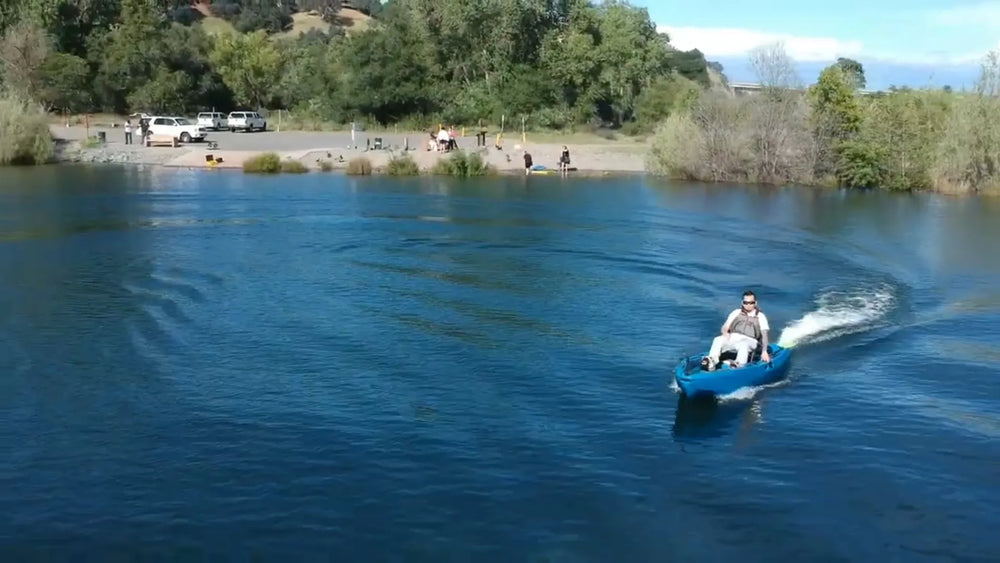 FluxJet electric kayak cruising across a calm lake