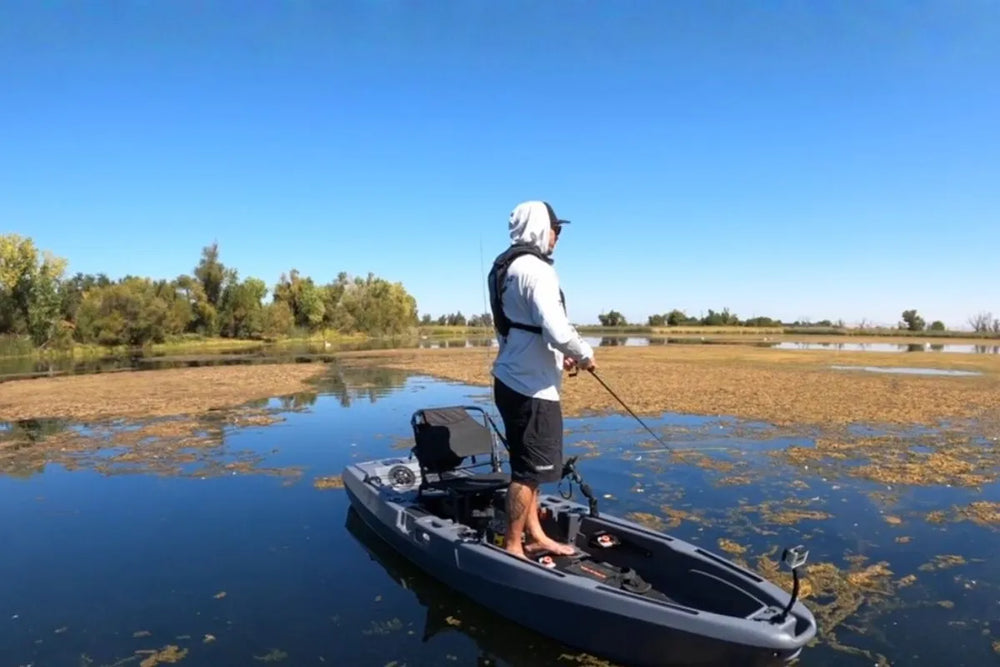 Angler standing on a FluxJet in shallow water