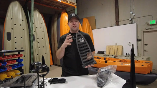 Jason demonstrating the FluxJet kayak ride plate during in-house engineering and testing