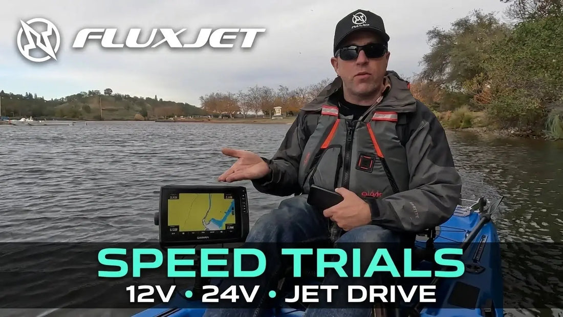FluxJet electric fishing kayak on the water during 12V and 24V speed trials, showing Garmin fish finder and jet drive performance testing.