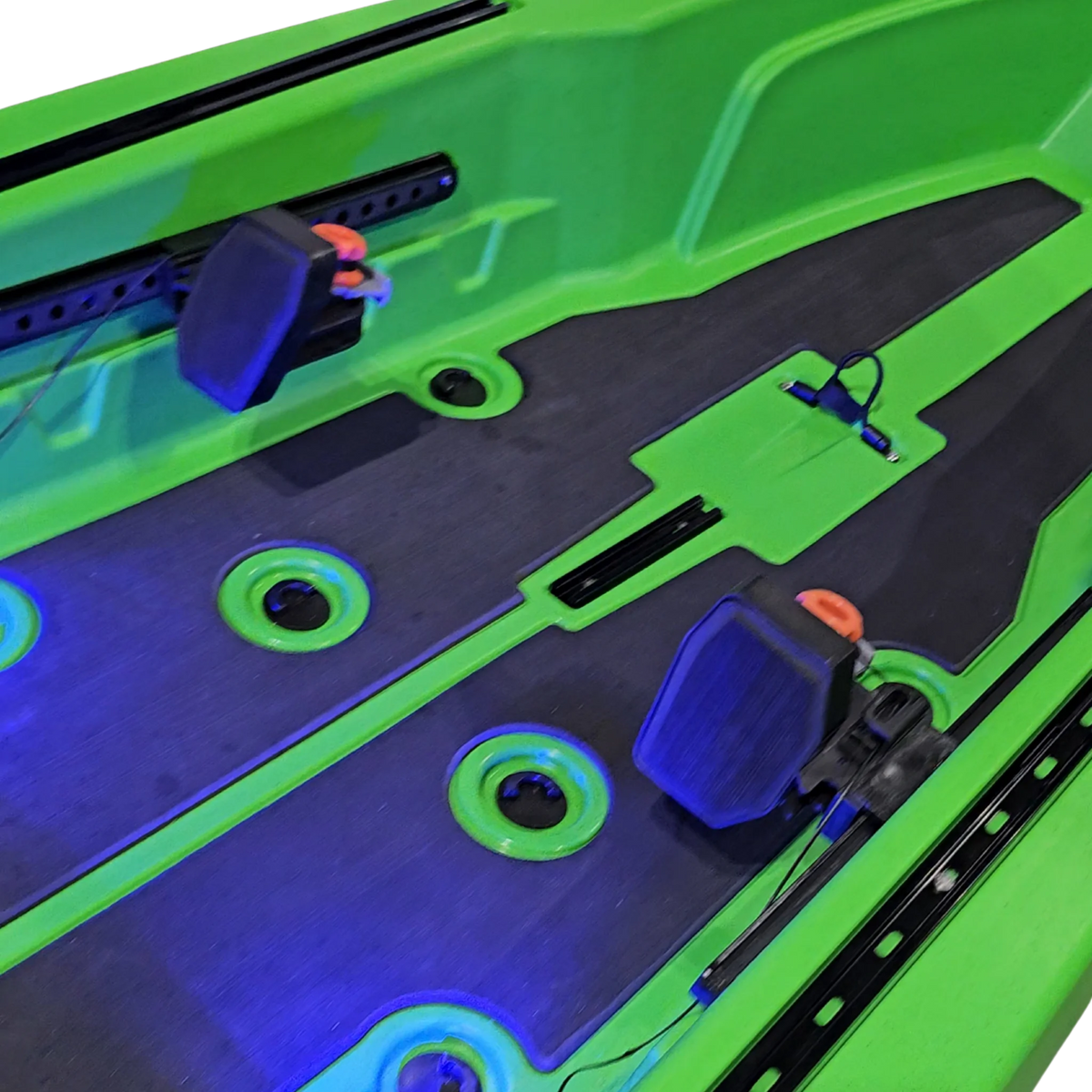 Foot steering pedals and blue LED deck lighting on a green FluxJet kayak