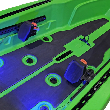 Foot steering pedals and blue LED deck lighting on a green FluxJet kayak