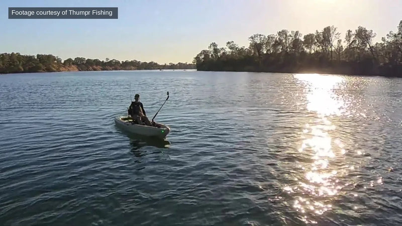 Angler on a FluxJet kayak at golden hour on a California lake