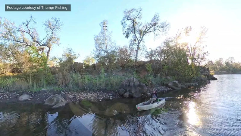 FluxJet kayak working a rocky shoreline in shallow water
